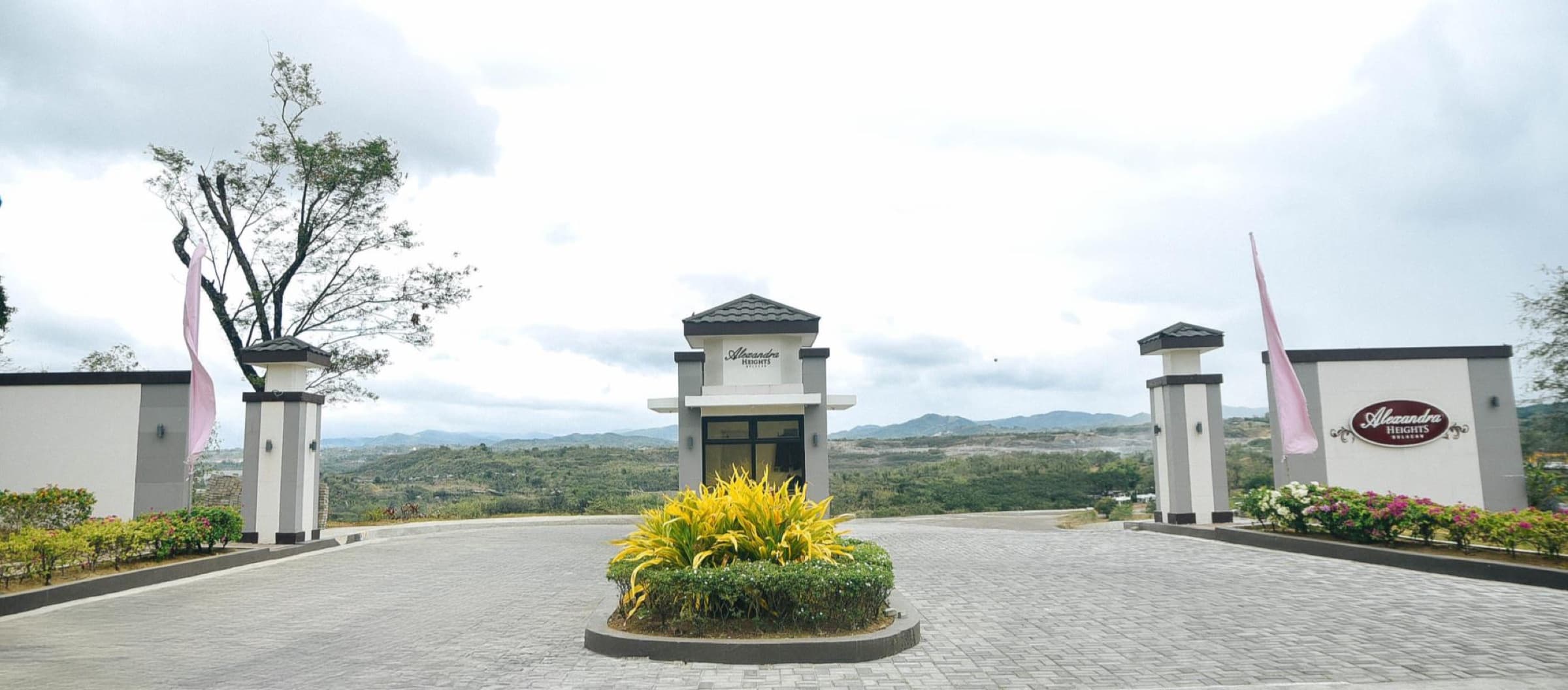 Alexandra Heights entrance gate with hills beyond (photo)