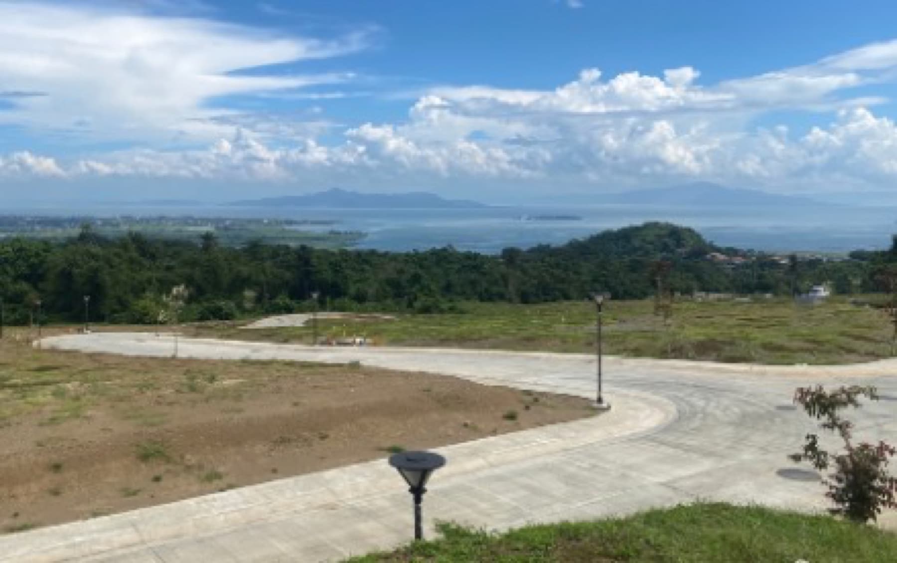 Ayala Greenfield Estates, Phase 10 roads with Laguna de Bay beyond (photo, October 2026)
