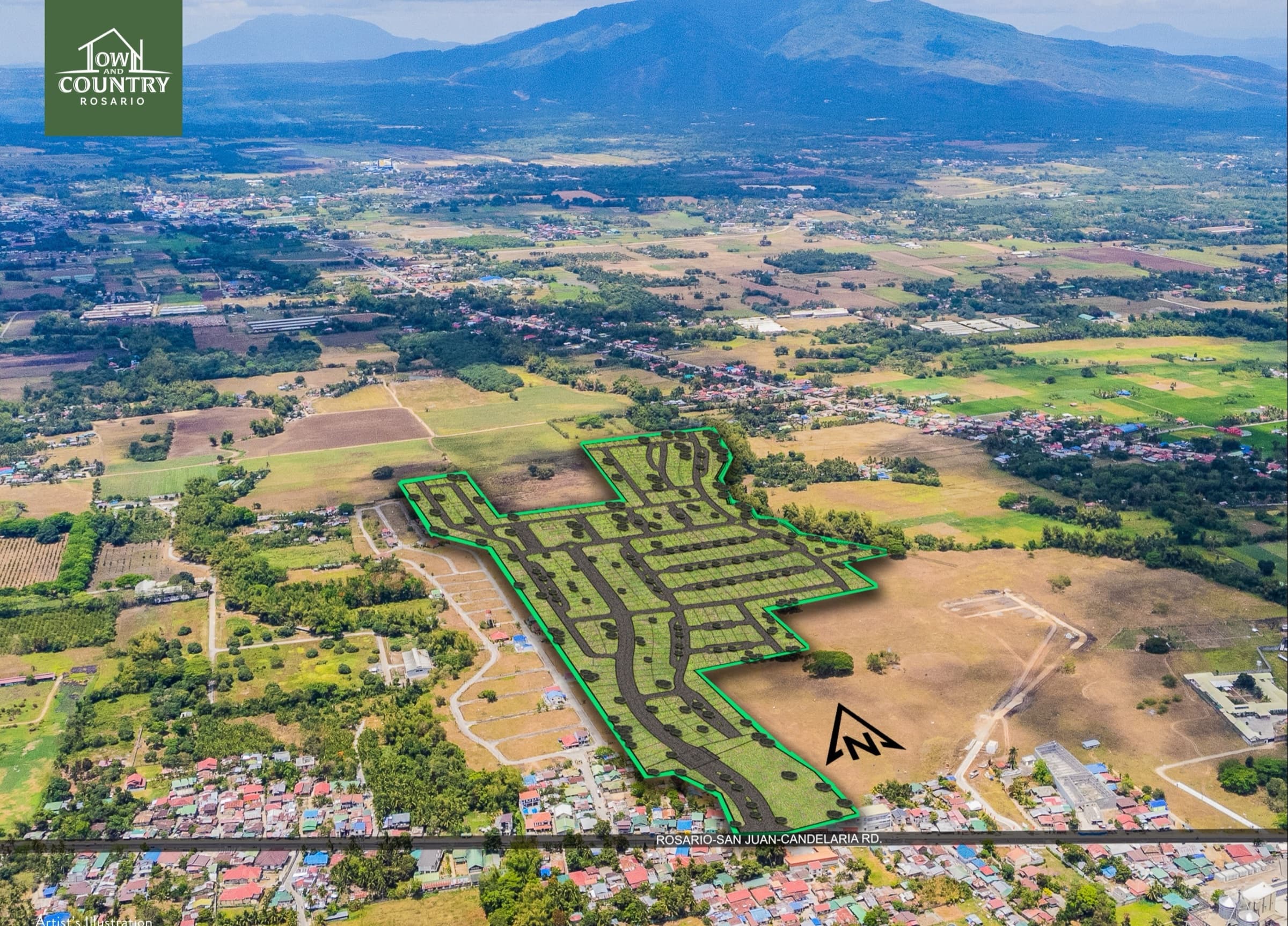 Aerial view of the Town & Country Rosario site in Bagong Pook, with the subdivision layout outlined against the surrounding farmland and mountains