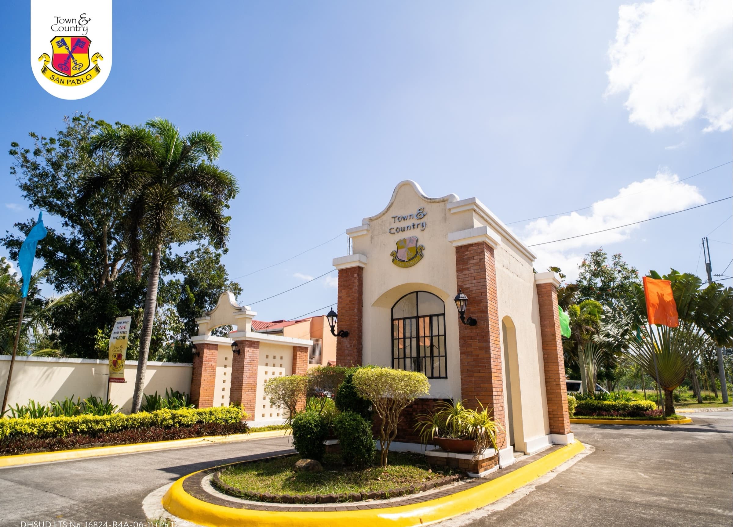 Hispanic-style arched entrance gate and guardhouse of Town & Country San Pablo